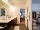 Modern bathroom with double vanity and access to bedroom and closet at 165 Old Harbor Dr, Mount Gilead, NC 27306