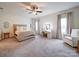 Spacious bedroom with large windows and plush carpet at 165 Old Harbor Dr, Mount Gilead, NC 27306