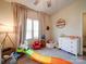 bedroom with toys, dresser, and window at 165 Old Harbor Dr, Mount Gilead, NC 27306