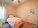 Cozy bedroom with a white metal bed frame and a cheerful atmosphere at 165 Old Harbor Dr, Mount Gilead, NC 27306