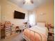 Adorable bedroom with a white metal bed frame and fun decor at 165 Old Harbor Dr, Mount Gilead, NC 27306