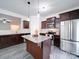 Modern kitchen with stainless steel appliances and granite countertops at 165 Old Harbor Dr, Mount Gilead, NC 27306