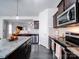 Modern kitchen with stainless steel appliances and granite countertops at 165 Old Harbor Dr, Mount Gilead, NC 27306