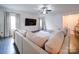 L-shaped sectional sofa in living room with hardwood floors and large TV at 165 Old Harbor Dr, Mount Gilead, NC 27306