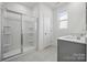 Modern bathroom with double vanity, shower, and grey tile floor at 2223 Carpenter Farms Dr, Lincolnton, NC 28092