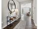 Bright entryway with modern console table and large mirror at 7055 Stella Pl, Stanley, NC 28164