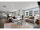 Open concept living room with kitchen and dining area visible at 7055 Stella Pl, Stanley, NC 28164