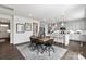 Kitchen and dining area featuring wooden table and gray cabinets at 7055 Stella Pl, Stanley, NC 28164