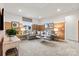 Cozy bonus room with sectional sofa and accent wall at 7055 Stella Pl, Stanley, NC 28164
