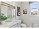 Modern bathroom with gray vanity and a large mirror at 7055 Stella Pl, Stanley, NC 28164