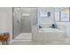 Bathroom with walk-in shower and soaking tub at 7055 Stella Pl, Stanley, NC 28164