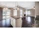 Eat-in kitchen with island, fireplace, and hardwood floors at 5811 Creft Cir, Indian Trail, NC 28079