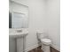 Simple powder room with pedestal sink and toilet at 744 Olde England Dr, Lincolnton, NC 28092