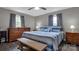 Bedroom with wooden dresser and bed with blue bedding at 192 Dunlap Loop, Statesville, NC 28625