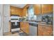 Kitchen with wood cabinets, stainless steel appliances, and decorative backsplash at 192 Dunlap Loop, Statesville, NC 28625