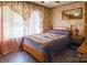 Bedroom with a double bed and floral wallpaper at 4537 Sunrise Beach Rd, Catawba, NC 28609