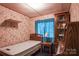 Small bedroom with twin bed and wooden furniture at 4537 Sunrise Beach Rd, Catawba, NC 28609