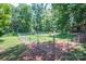 Fenced backyard with bird bath and mature trees at 4537 Sunrise Beach Rd, Catawba, NC 28609