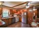 Cozy kitchen featuring wood cabinets, stainless steel appliances, and a tile floor at 4537 Sunrise Beach Rd, Catawba, NC 28609