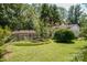 Landscaped backyard with a patio and garden area at 4537 Sunrise Beach Rd, Catawba, NC 28609