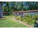 Mobile home exterior with landscaped yard and brick walkway at 4537 Sunrise Beach Rd, Catawba, NC 28609