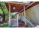 Covered front porch with wooden railing and steps at 4537 Sunrise Beach Rd, Catawba, NC 28609