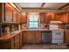 L-shaped kitchen with wood cabinets, and stainless steel appliances at 4537 Sunrise Beach Rd, Catawba, NC 28609