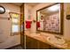 Bathroom with double vanity, shower, and nautical-themed decor at 4537 Sunrise Beach Rd, Catawba, NC 28609