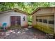 Two-car garage with dark brown doors and gravel area at 4537 Sunrise Beach Rd, Catawba, NC 28609
