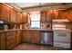 Galley kitchen with wood cabinets and stainless steel appliances at 4537 Sunrise Beach Rd, Catawba, NC 28609