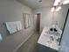 Double vanity bathroom with gray tile floors and neutral decor at 6341 Mallow Crossing Lane Ln, Charlotte, NC 28213