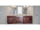 Double vanity bathroom with modern wood cabinets at 7266 Waterwheel Sw St, Concord, NC 28025