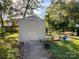 Tan colored storage shed with concrete pathway at 412 E 18Th St, Charlotte, NC 28206