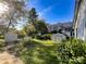 Large backyard with two storage sheds and lush landscaping at 412 E 18Th St, Charlotte, NC 28206