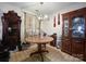 Dining room with round table and wooden hutch at 412 E 18Th St, Charlotte, NC 28206