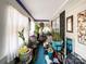 Enclosed porch with plants and various household items at 412 E 18Th St, Charlotte, NC 28206