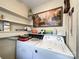 Laundry area with washer, dryer, and shelving at 412 E 18Th St, Charlotte, NC 28206