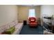 Cozy living room featuring a sofa and armchair at 412 E 18Th St, Charlotte, NC 28206