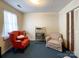 Bedroom with two armchairs and a vintage television at 412 E 18Th St, Charlotte, NC 28206