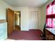 Bedroom with closet, window, and access to another room at 412 E 18Th St, Charlotte, NC 28206