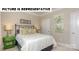 Well-lit bedroom with a comfortable bed and closet at 114 Sari St, Troutman, NC 28166