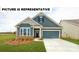 Two-story craftsman style home with gray siding, stone accents and a two-car garage at 110 Ari Ave, Troutman, NC 28166