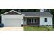 Newly constructed home with white siding, brown accents, and a two-car garage at 4050 Fairview Ln, Maiden, NC 28650