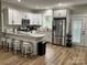 Modern kitchen with white cabinets, granite counters, and stainless steel appliances at 4050 Fairview Ln, Maiden, NC 28650