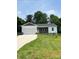 Ranch style home with driveway, landscaped lawn, and spacious yard at 4050 Fairview Ln, Maiden, NC 28650