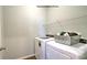 Functional laundry room with washer, dryer, shelving, and storage basket at 1421 6Th Ne St, Hickory, NC 28601