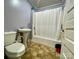 Small bathroom with shower/tub combo and pedestal sink at 84 Walnut Ave, Gastonia, NC 28054
