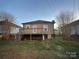 Backyard view with elevated deck and partial view of neighboring home at 84 Walnut Ave, Gastonia, NC 28054