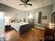Bright bedroom with wood floors and ceiling fan at 84 Walnut Ave, Gastonia, NC 28054