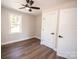 Bright bedroom featuring a ceiling fan and spacious closet at 7025 Nc Hwy 73 E Hwy, Mount Pleasant, NC 28124